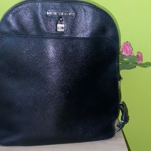 Michael kors black leather backpack.